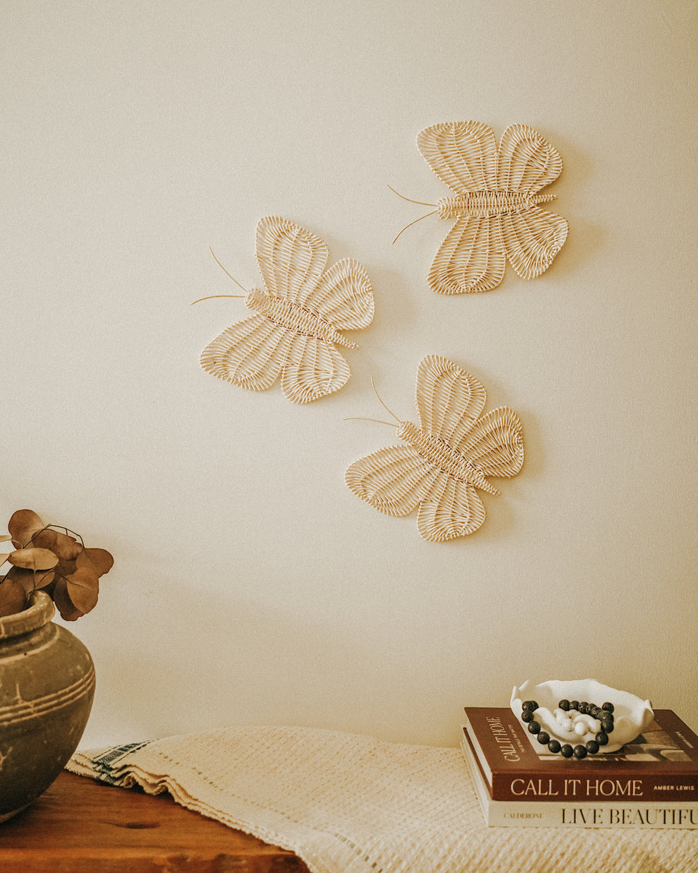 Butterflies wall hanging made from natural rattan, ethically crafted for unique home décor.