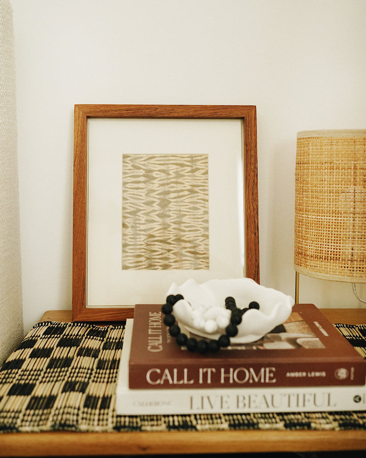 Pink Tie Die Textile Wall Art in Mountboard Frame Front on bedside table